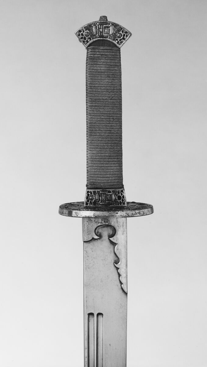 Liuyedao Chinese saber hilt and guard detail Liuyedao Chinese saber hilt and guard detail