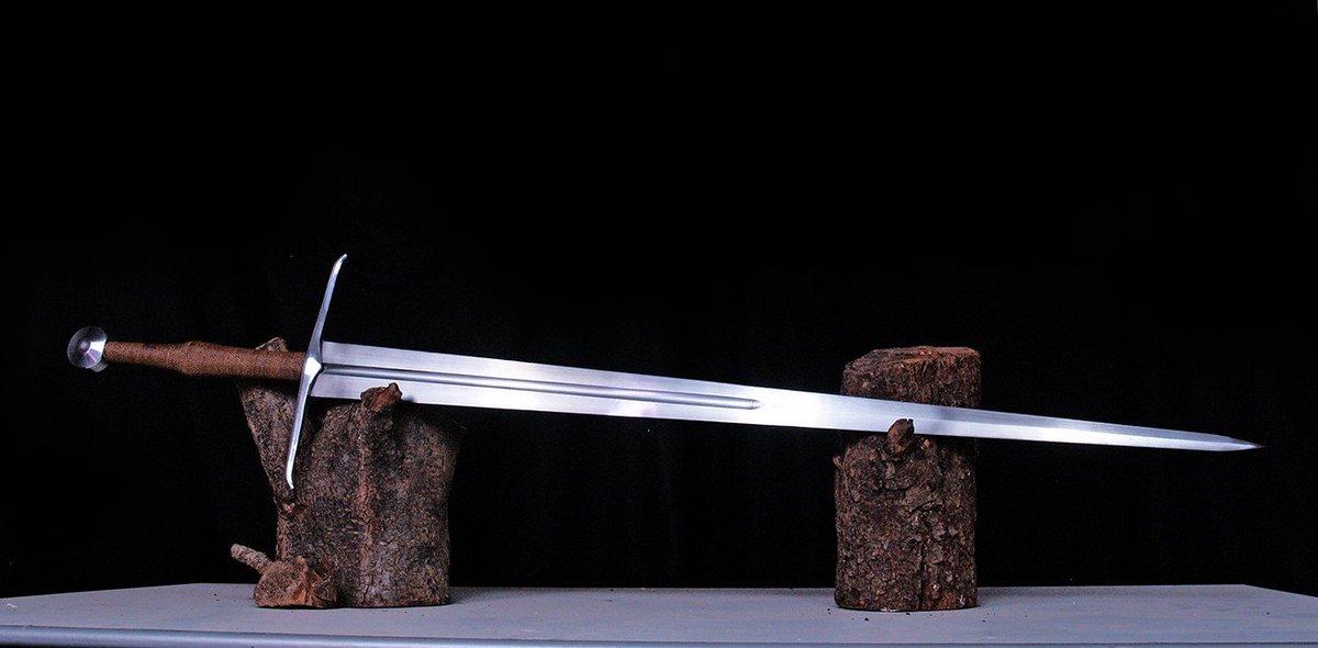 Medieval European double edged sword with straight blade design Medieval European double edged sword with straight blade design