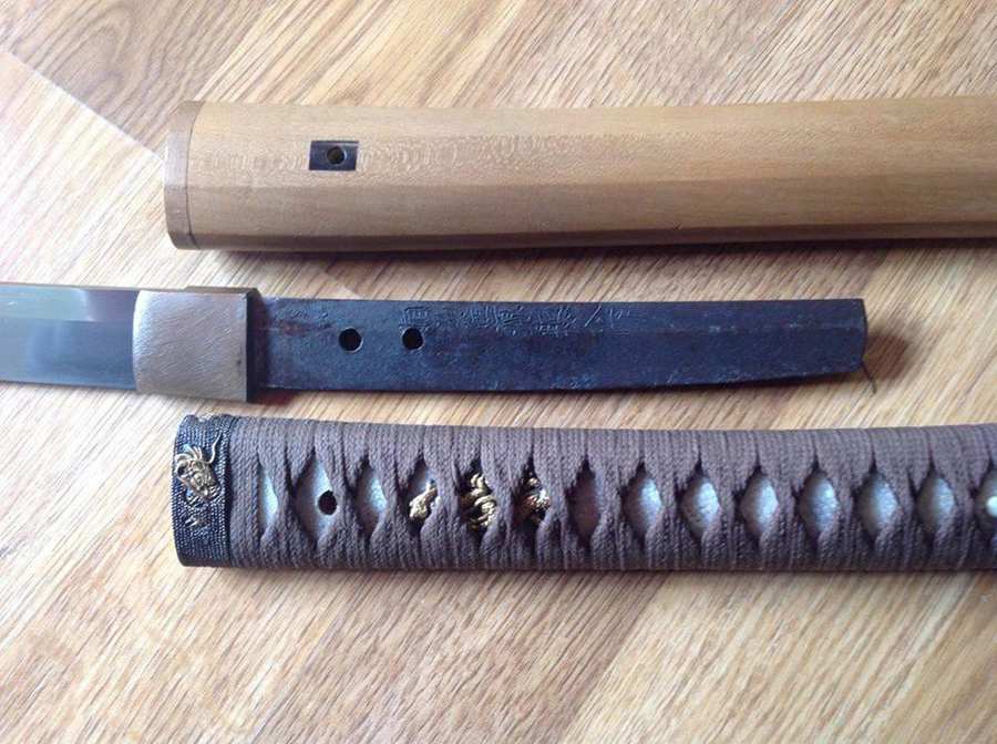 Katana with the tsuka handle removed to reveal the nakago tang and mekugi holes