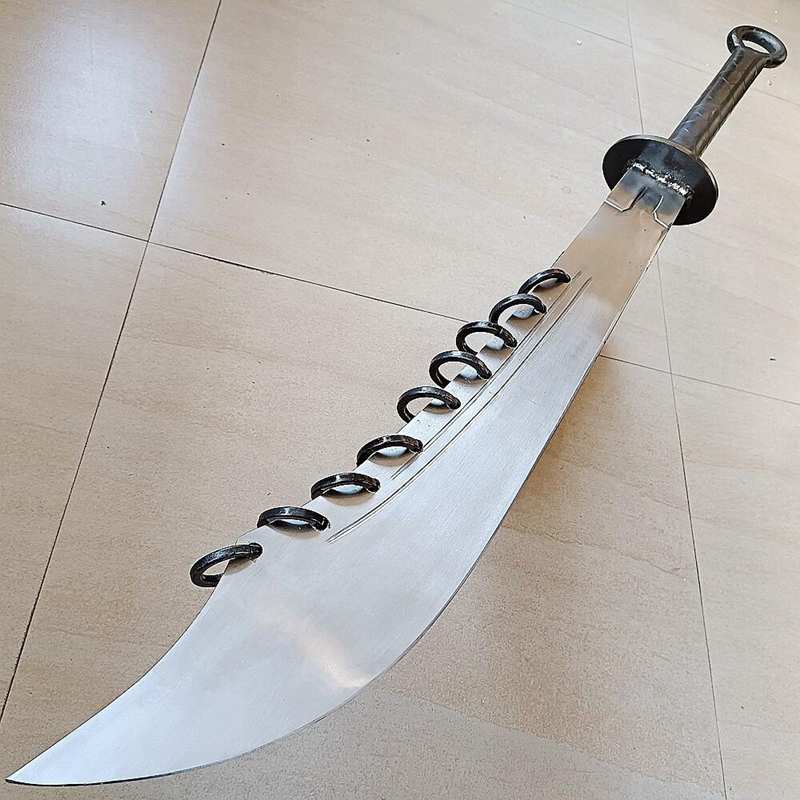 Traditional Chinese nine ring broadsword with metal rings along the blade spine Traditional Chinese nine ring broadsword with metal rings along the blade spine