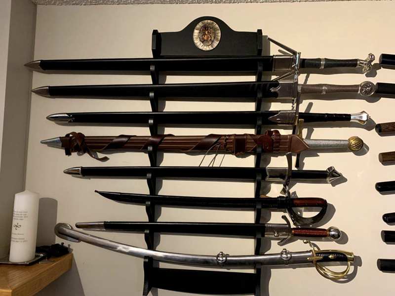 Collection of fantasy movie swords and iconic weapons from films Collection of fantasy movie swords and iconic weapons from films