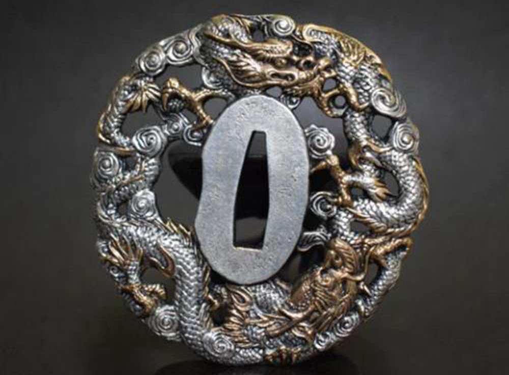 Japanese sword tsuba with dragon engraving and traditional artwork Japanese sword tsuba with dragon engraving and traditional artwork