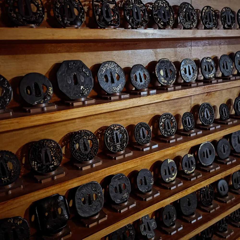 Collection of antique sword guards and traditional sword fittings Collection of antique sword guards and traditional sword fittings