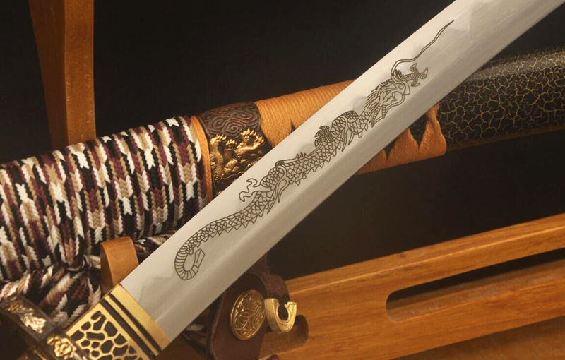 Dragon engraving design on handmade Japanese Katana blade Dragon engraving design on handmade Japanese Katana blade