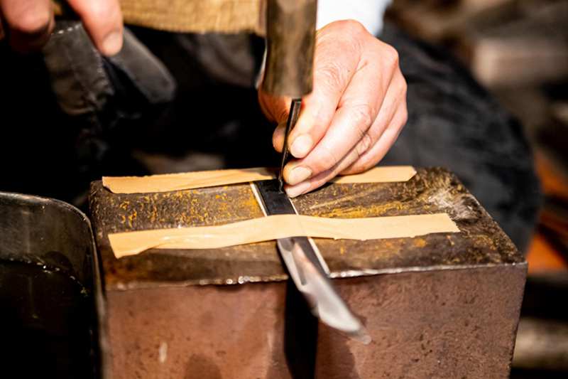 Custom Katana engraving process showing sword personalization Custom Katana engraving process showing sword personalization