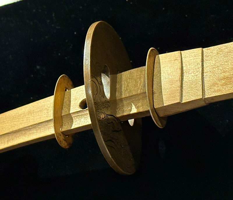 Katana tsuba with Seppa spacer installed between sword fittings Katana tsuba with Seppa spacer installed between sword fittings